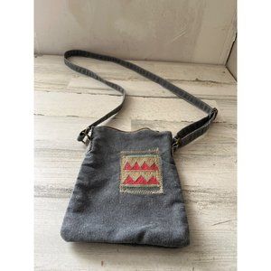 Vintage Addiction woman’s grey cloth crossbody purse